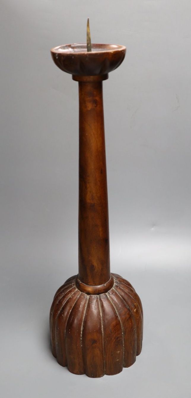 A carved hardwood pricket candlestick, height 58cm